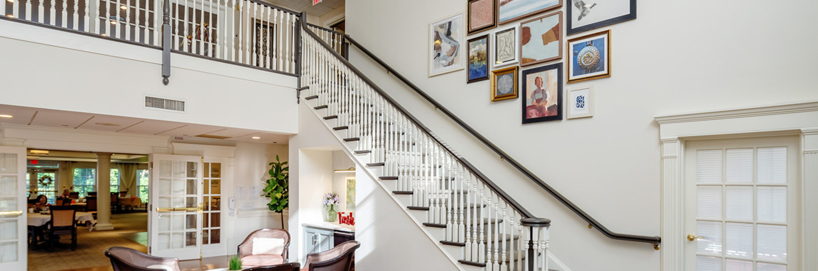 A bright lobby area with a staircase.