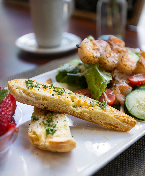 Shrimp salad and bread with fruit.