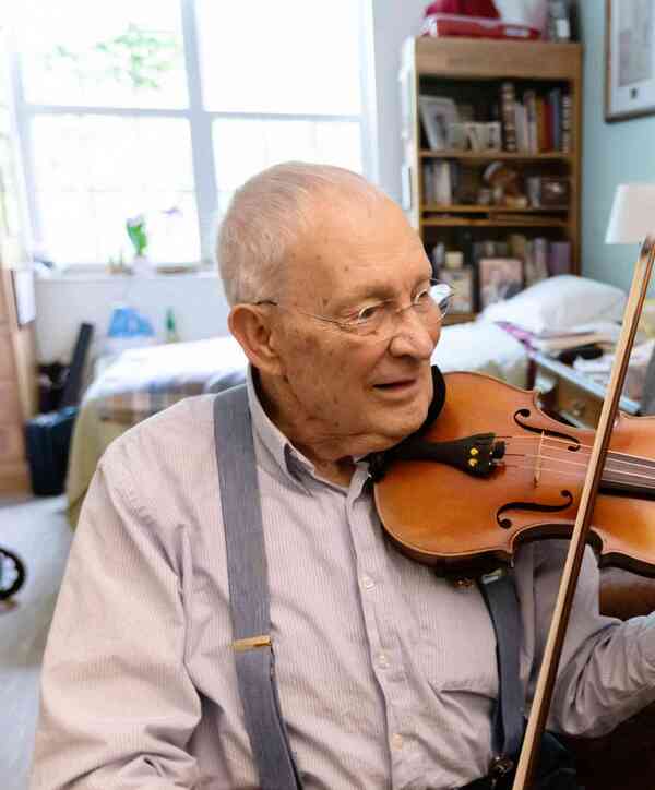 Resident playing violin