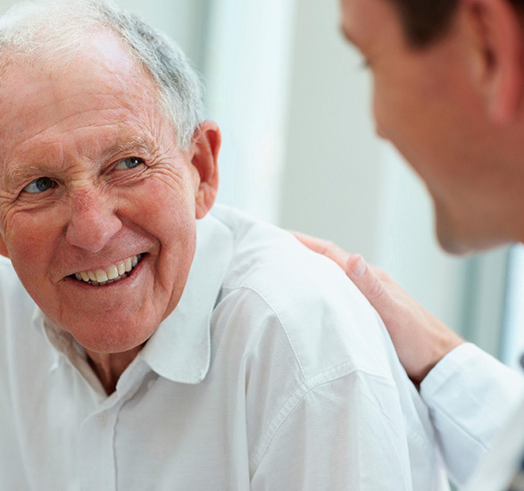 A doctor consulting a resident.