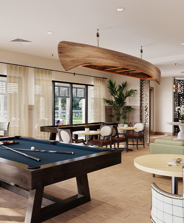 Accordion image A activity room with a billiards table.