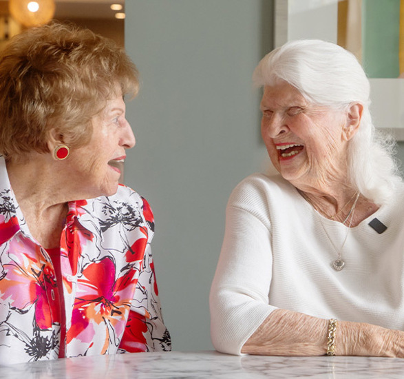 Two people laughing.