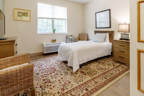 A fully furnished apartment bedroom.