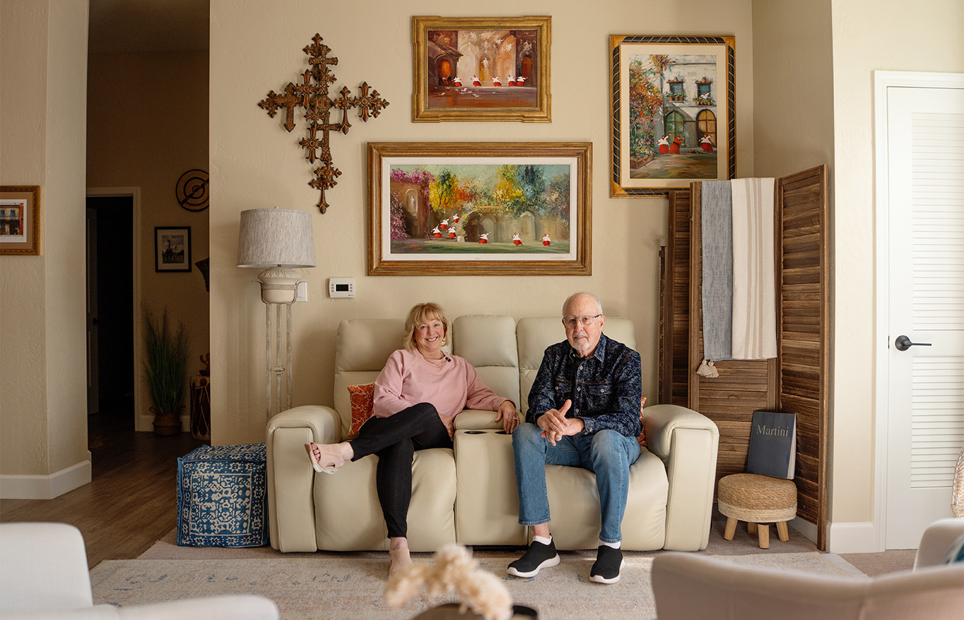 Two people sitting on the couch.