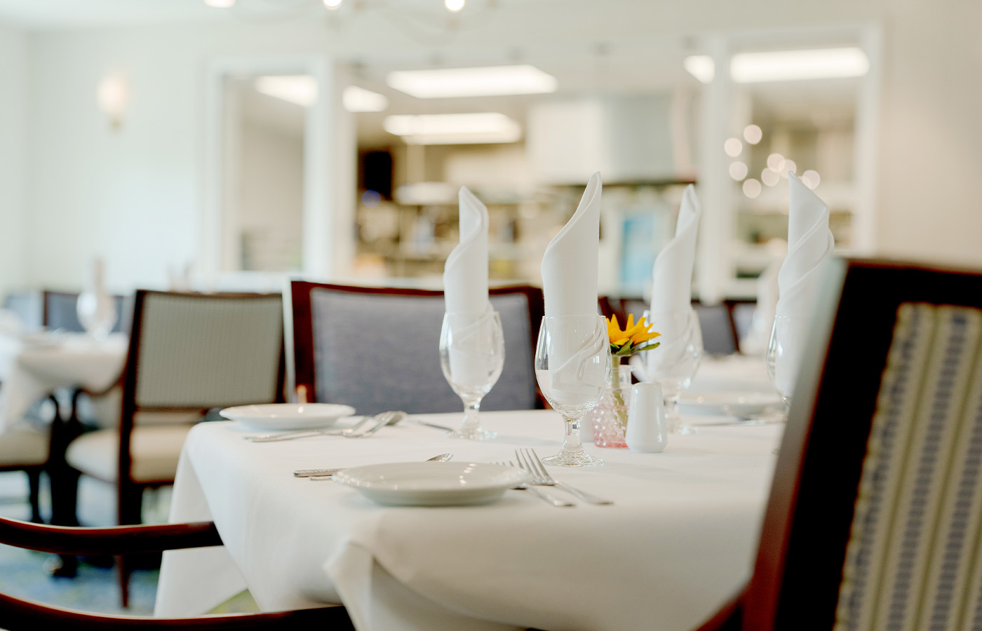 A dining table set for dinner.