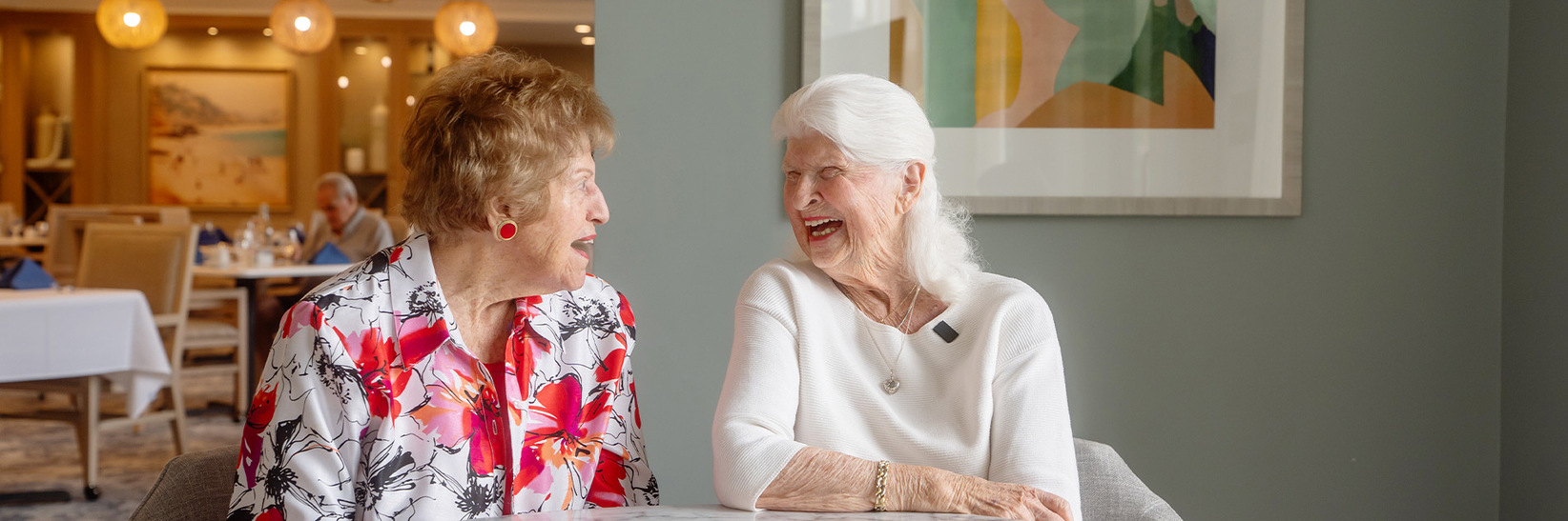 Two people laughing at Watermark Laguna Niguel Independent living community. Two people laughing at Watermark Laguna Niguel Independent living community.
