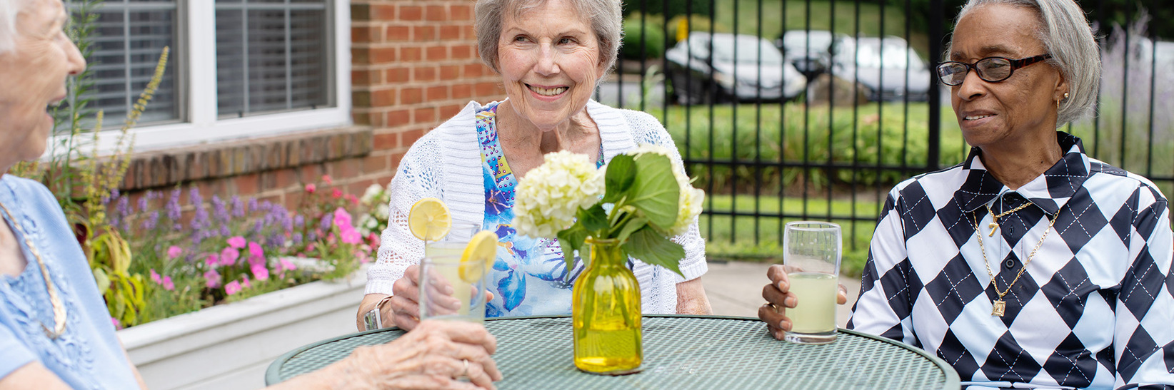 Friends having drinks on the patio of Rockland Place Senior Living Community in Wilmington, DE. Friends having drinks on the patio of Rockland Place Senior Living Community in Wilmington, DE.