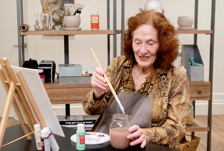 A resident in a painting class.