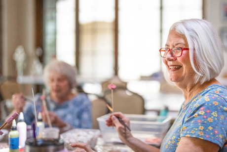 Members at The Hacienda at the Canyon senior living community painting in a class.