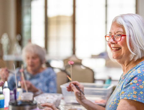 Members at The Hacienda at the Canyon senior living community painting in a class.