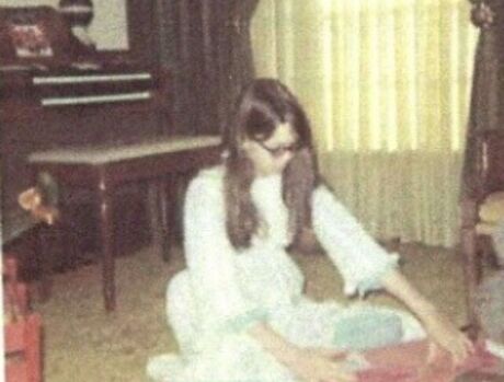 Katherine is opening her present.
