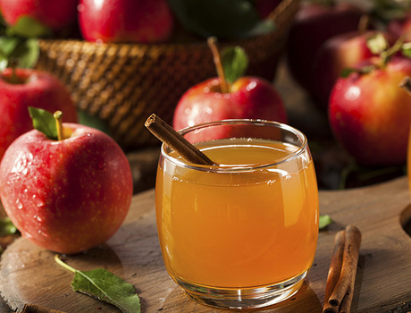 A glass of apple cider.