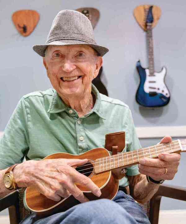 Resident playing guitar. Resident playing guitar.