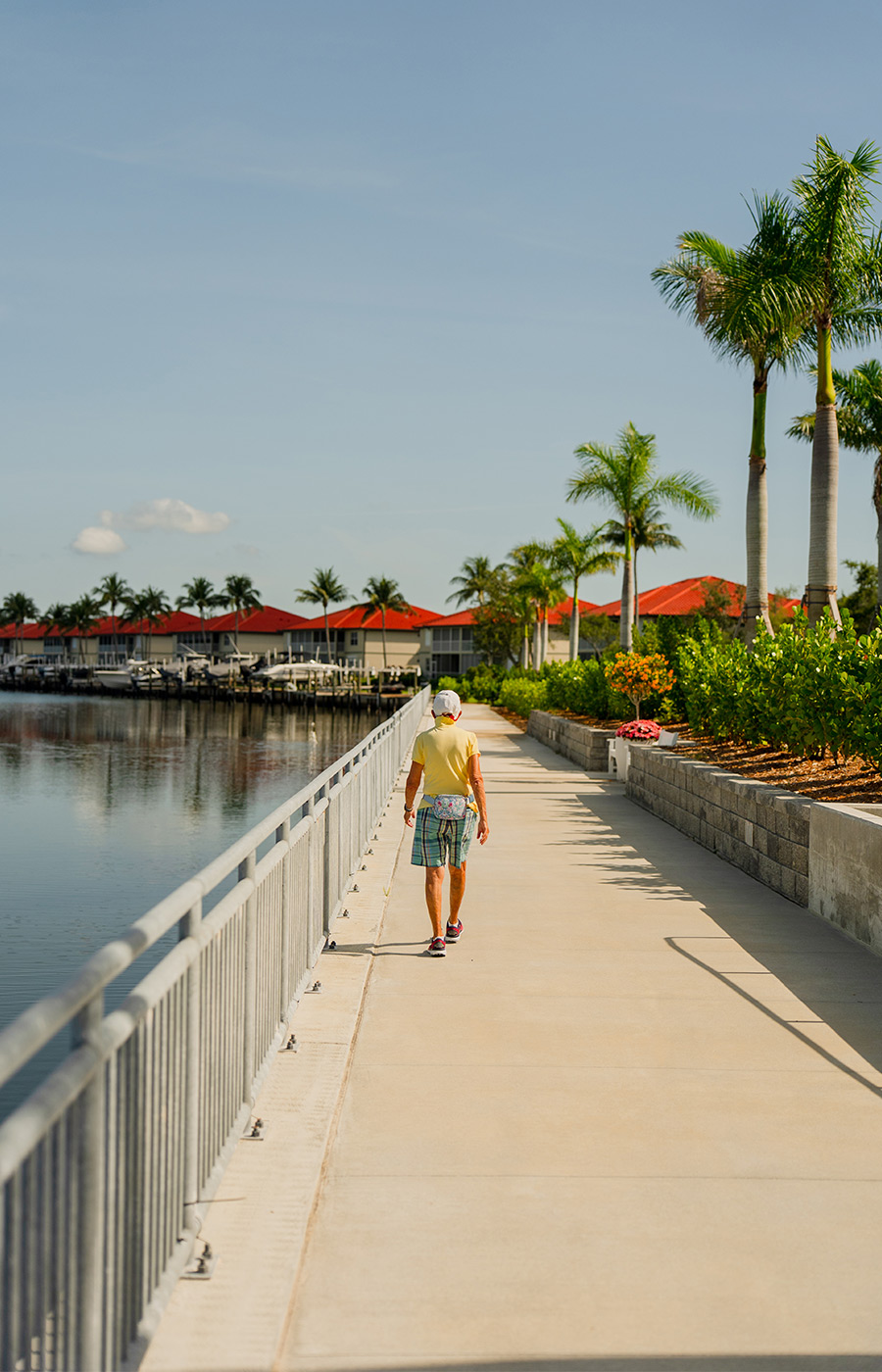 A person walking along the water.