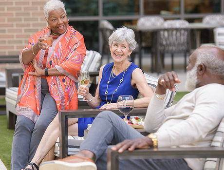 A group of residents outside having drinks.