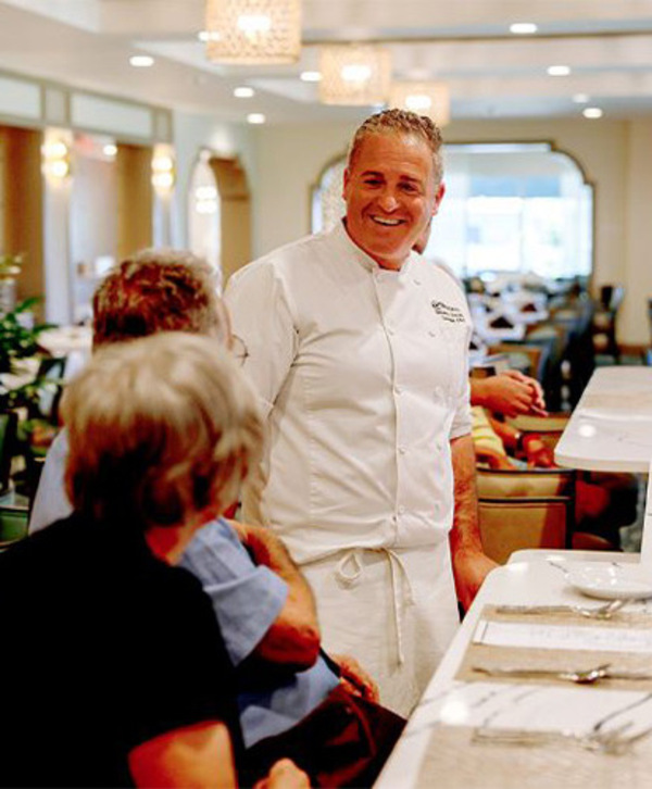 Accordion image A chef and the residents are at a restaurant in the community.