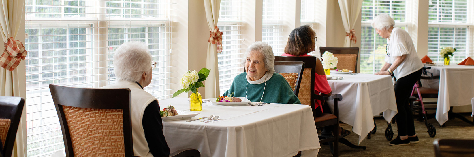 People eating in the dining room. People eating in the dining room.