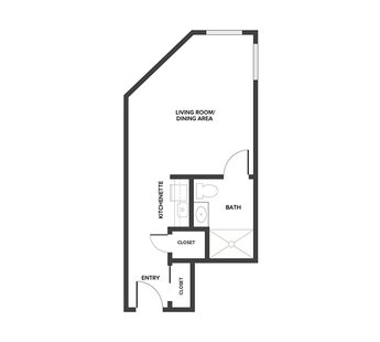 An assisted living studio suite floor plan with an open living/bedroom space and kitchenette.