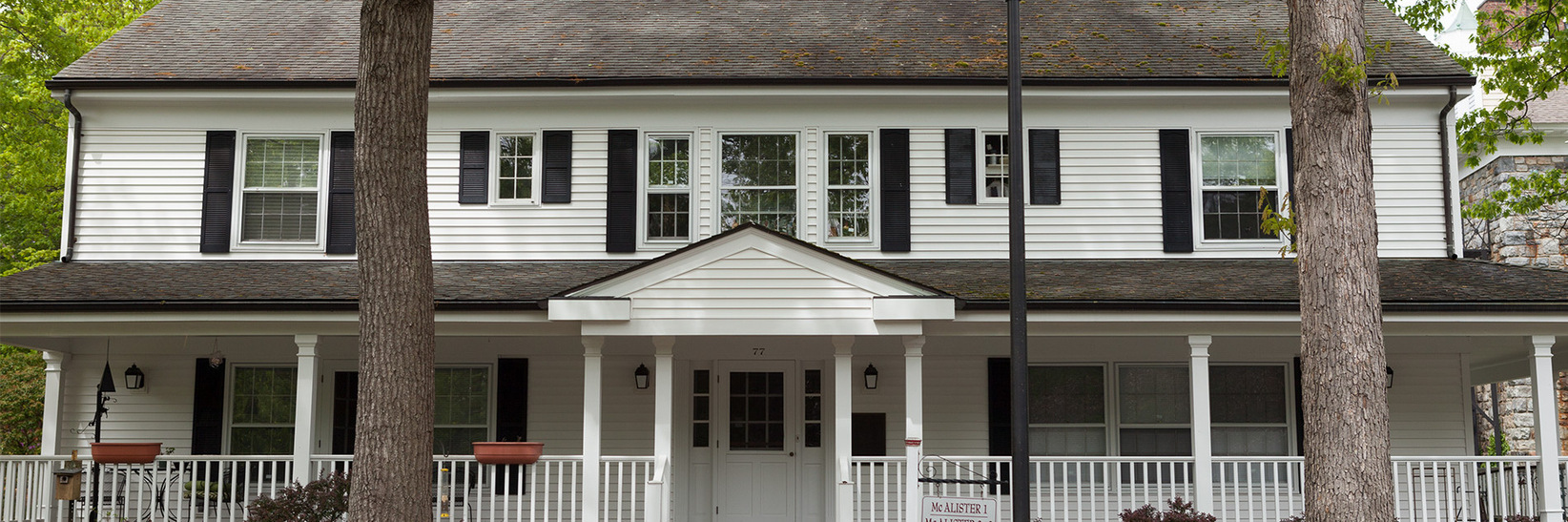 A house with a wrap around porch.