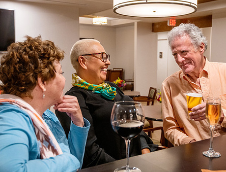 Residents with drinks at the Gallery Bar and Cafe.