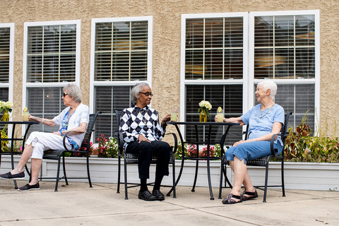 People having drinks on the patio.