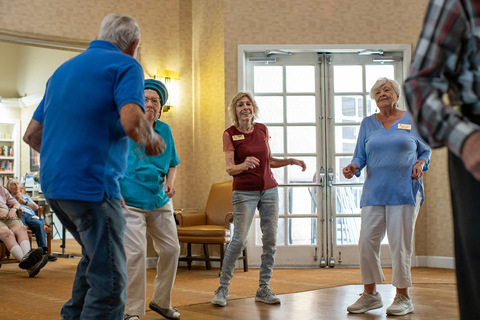 People dancing at happy hour.