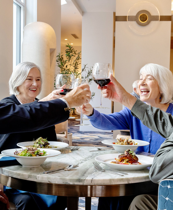 People out to dinner toasting with wine. People out to dinner toasting with wine.
