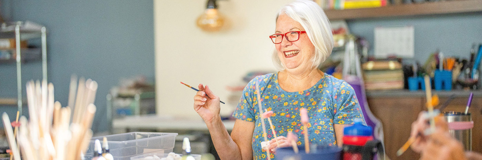 Residents enjoying an art class. Residents enjoying an art class.
