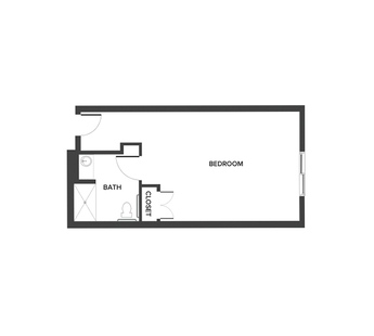 A memory care studio floor plan with an open living space and a bathroom.