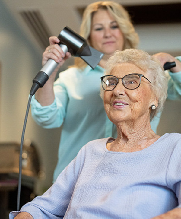 A person getting their hair dried.