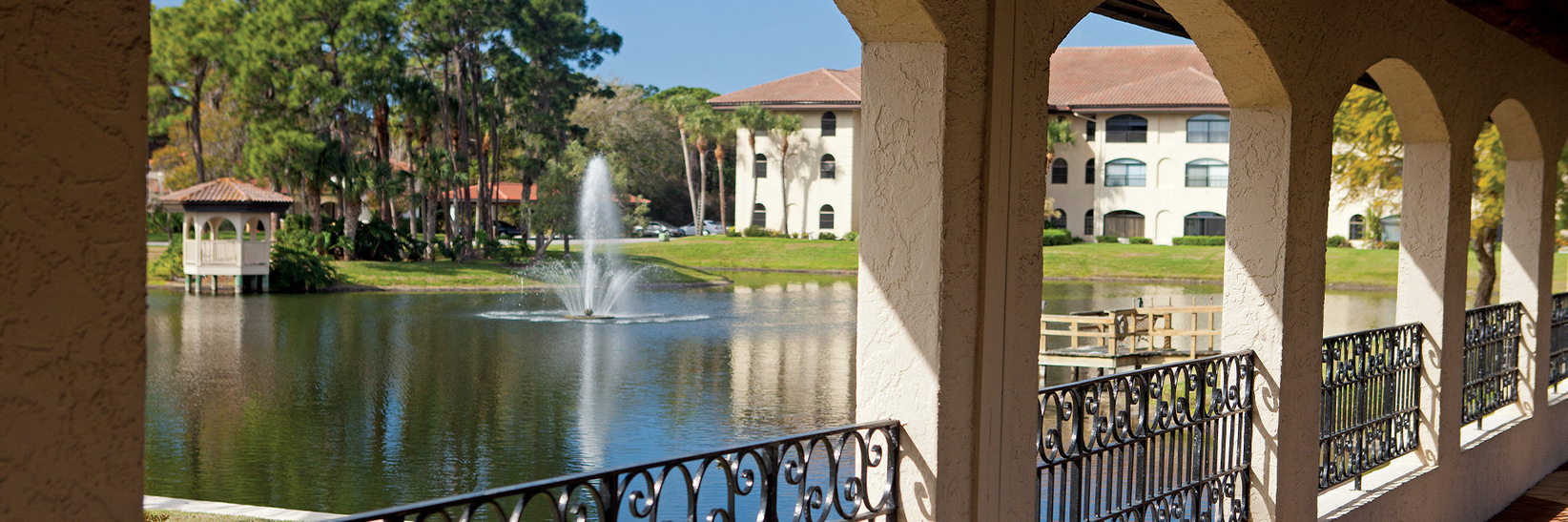 View through arches of building by a lake. View through arches of building by a lake.