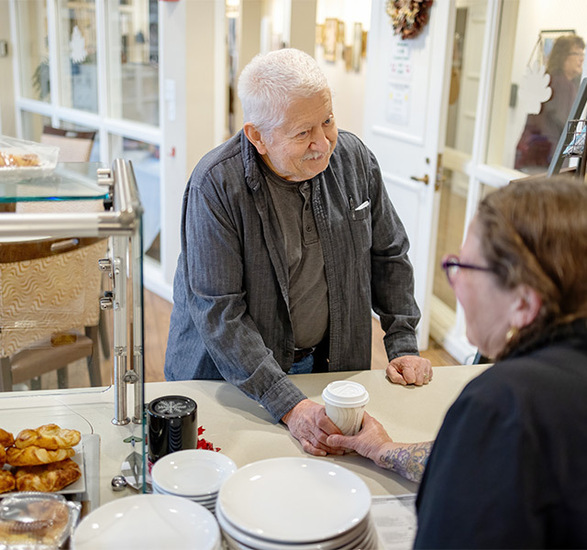 A person buying coffee.