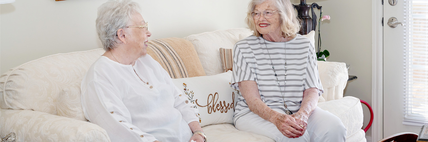 Two people sitting on a couch.