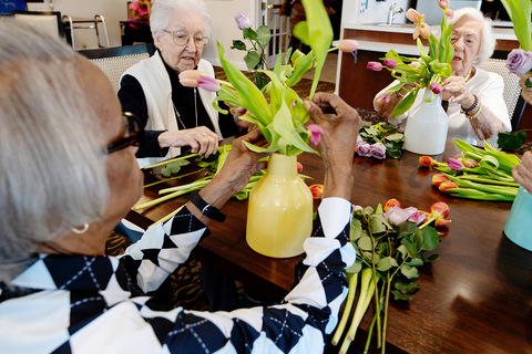 People arranging flowers.