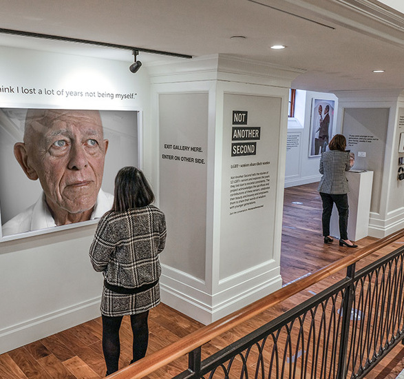 People are looking at the Not Another Second exhibit.