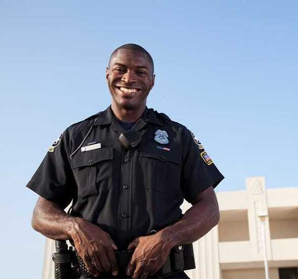 A police officer smiling