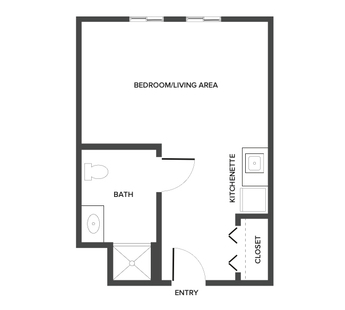An assisted living studio suite floor plan with an open living/bedroom space and kitchenette.