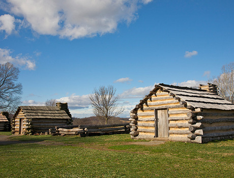 Two log cabins outside
