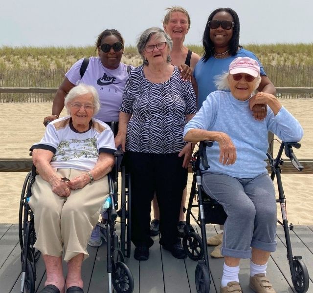 Residents are at a beach together.