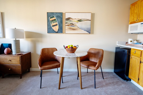 A furnished dining area in a studio apartment.