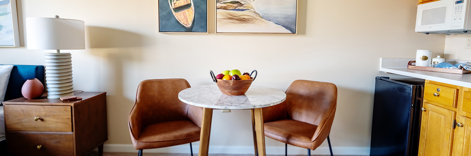 A furnished dining area in a studio apartment. A furnished dining area in a studio apartment.