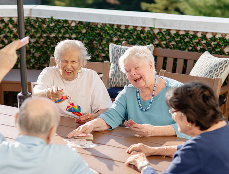 People playing cards outside.