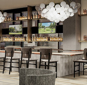 Luxury senior living bar with seating area.