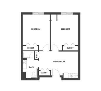 An assisted living shared suite floor plan with two bedrooms, a living room and kitchenette.