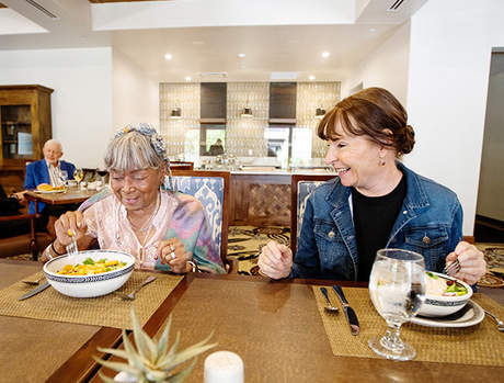 two people sitting and eating