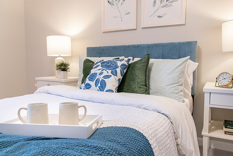 A fully furnished bedroom used for short-term senior living in San Jose.