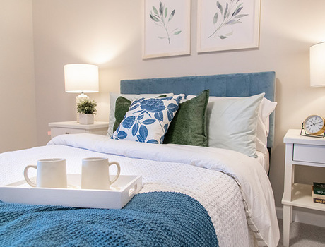 A fully furnished bedroom used for short-term senior living in San Jose.