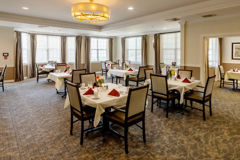 A dining room set for dinner.