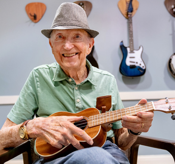 A resident playing the Ukulele. 