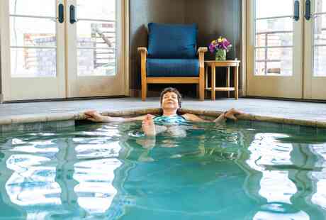 Member relaxing in the indoor pool.